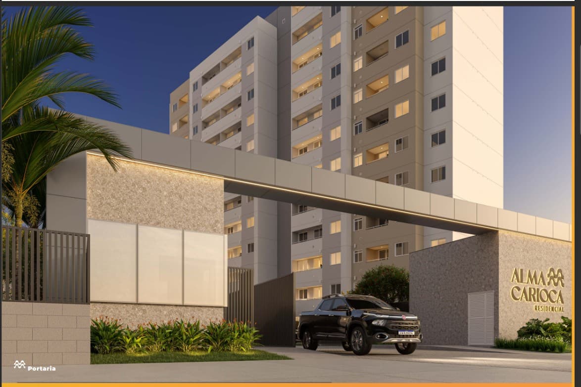 Fachada do condomínio com portaria moderna, guarita e torre residencial ao fundo