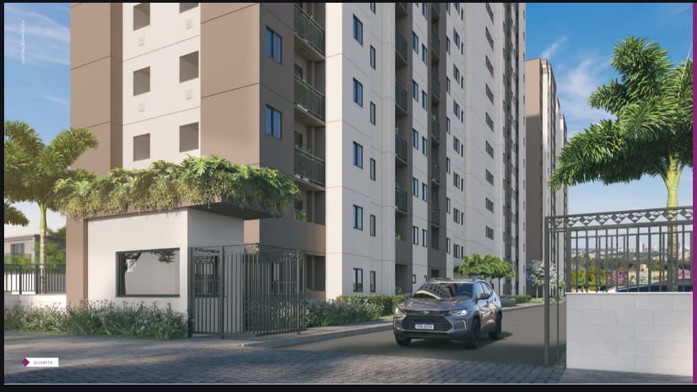 Fachada externa do condomínio com guarita, portão de acesso de veículos, paisagismo com palmeiras e torres residenciais ao fundo.